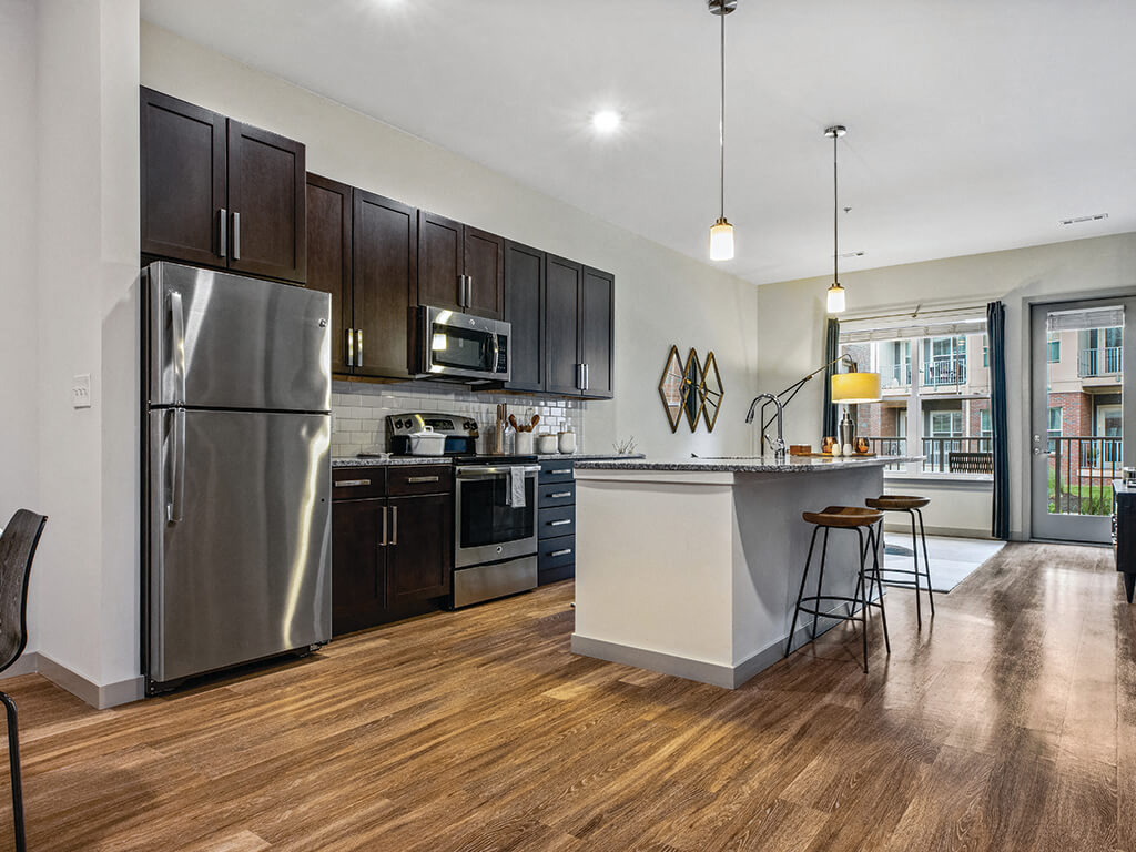 Kitchen with island seating at The Slate at Andover Apartments in Andover MA